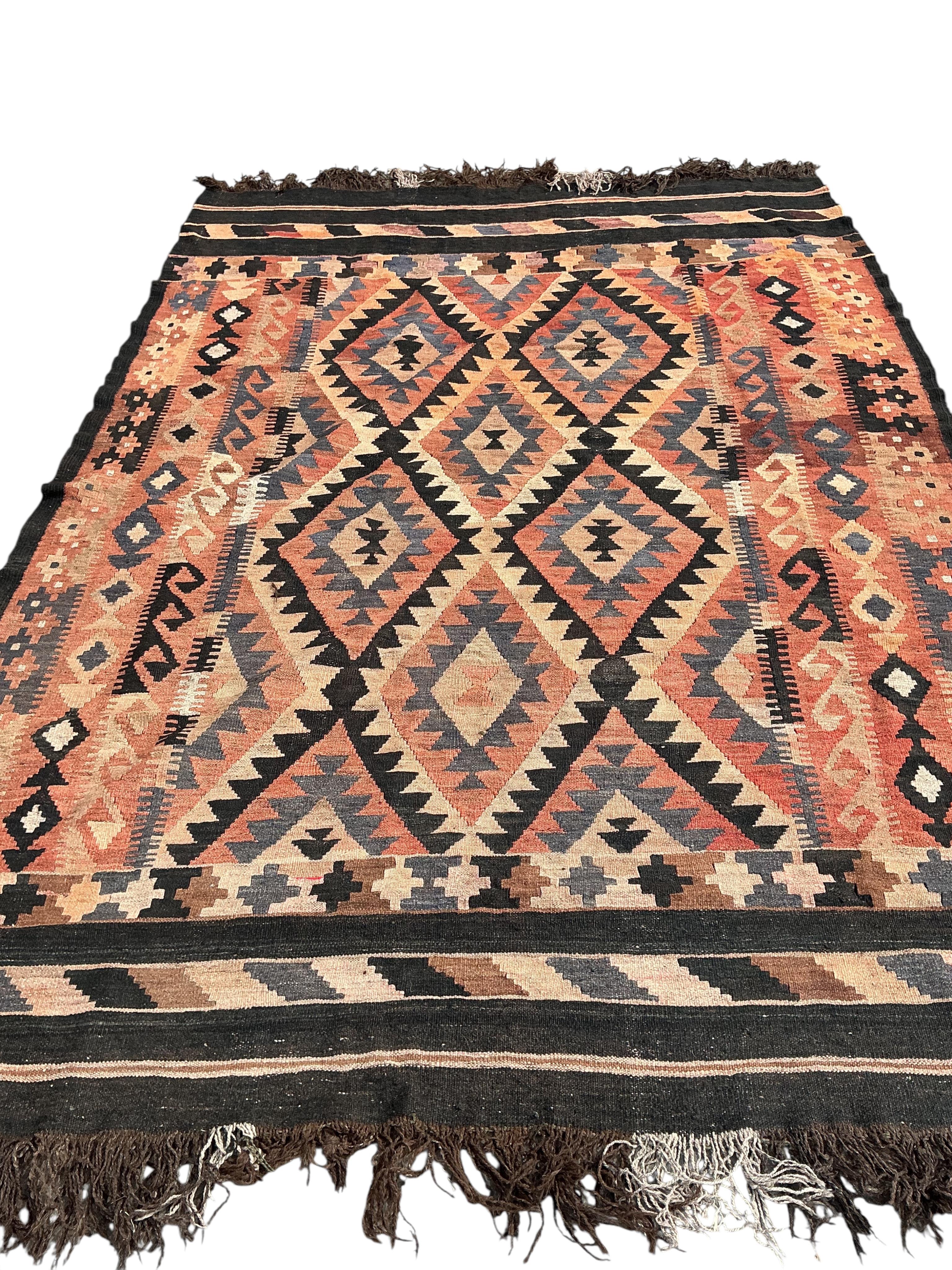 A Kilim polychrome flatweave carpet, 240 x 180cm
